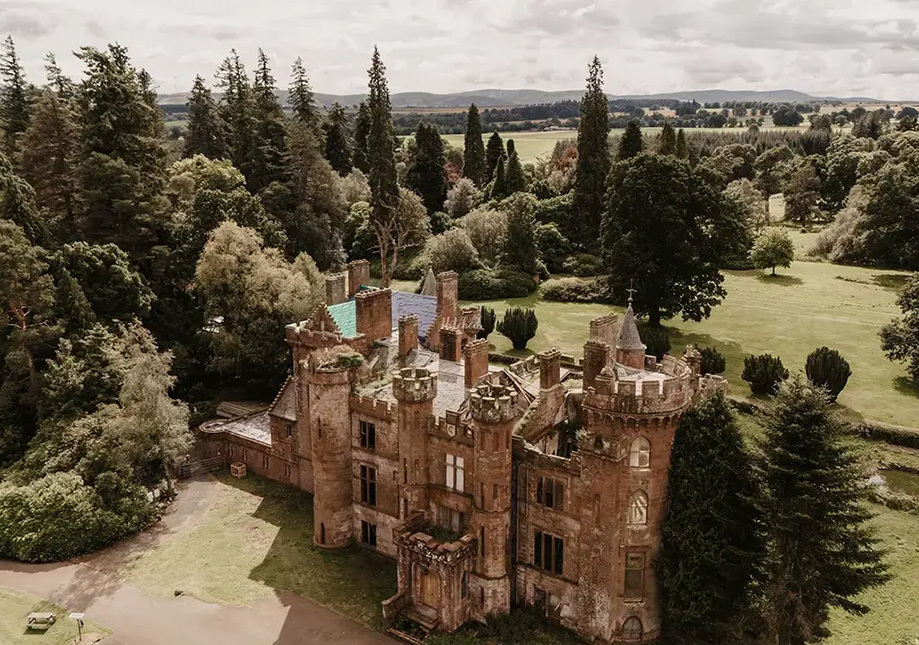 Aerial view of Culdees Castle Estate wedding venue surrounded by Perthshire countryside